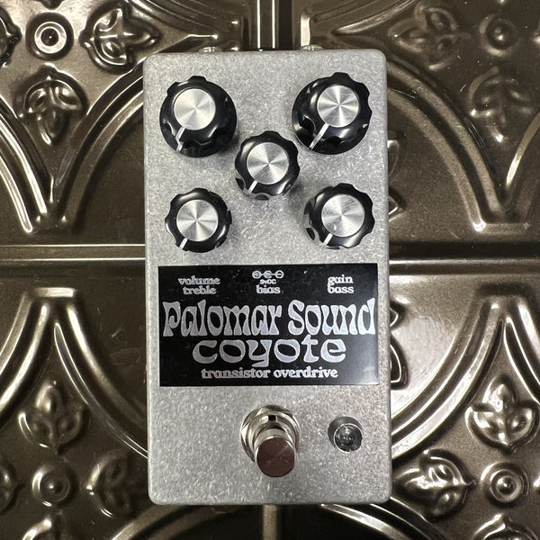 Guitar effects pedal with 'Palomar Sounds' branding on a metallic background