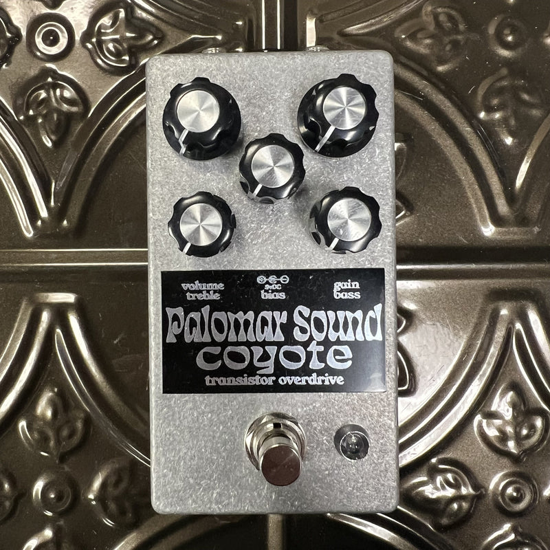 Guitar effects pedal with 'Palomar Sounds' branding on a metallic background
