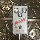 Guitar effects pedal with 'Greer Amps' branding on a decorative metal surface
