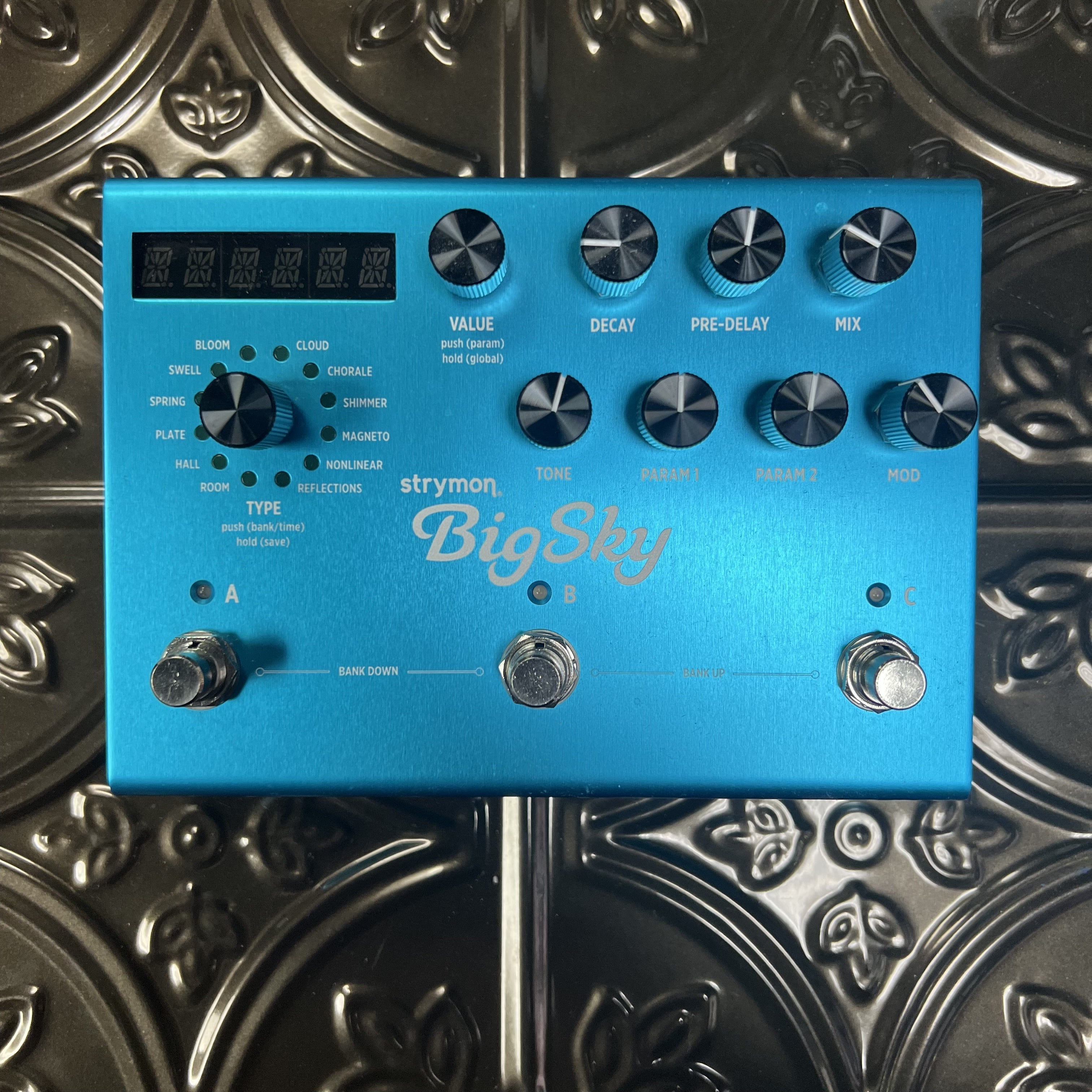 Blue guitar effects pedal with 'Big Sky' branding on a metallic surface